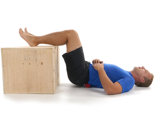 A man doing a low back release exercise