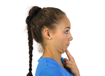 A woman doing a chin tuck